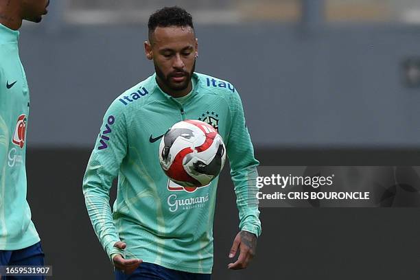 Brazil's forward Neymar eyes the ball during a training session in Lima, on September 11 on the eve of their 2026 FIFA World Cup South American...