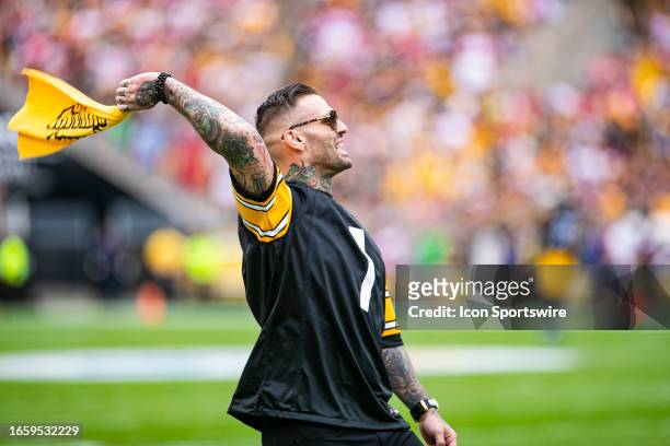 Former WWE star Matthew Polinsky also known as Corey Graves waves a terrible towel during the regular season NFL football game between the San...