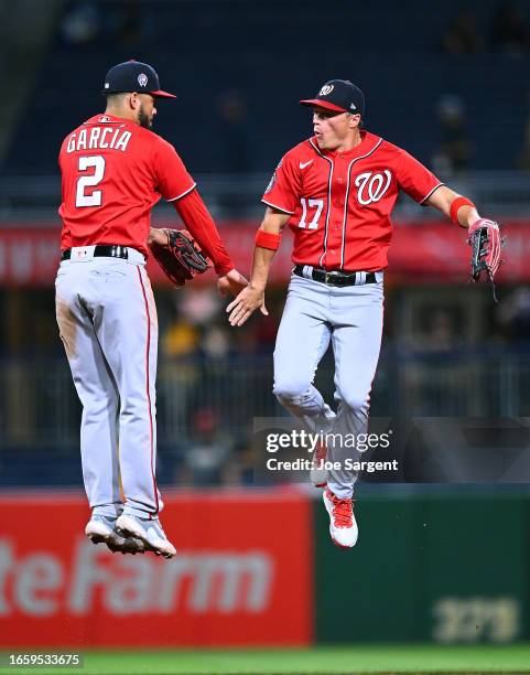 Luis Garcia celebrates with Alex Call of the Washington Nationals after a 6-2 win over the Pittsburgh Pirates at PNC Park on September 11, 2023 in...