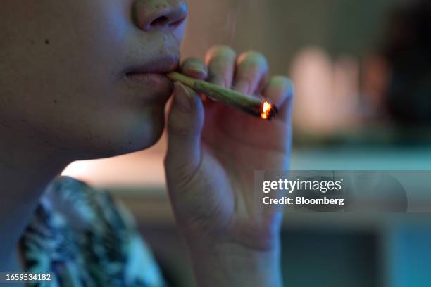 Customer smokes a joint inside a cannabis dispensary in Bangkok, Thailand, on Sunday, Sept. 10, 2023. An ongoing regulatory vacuum, which emerged a...