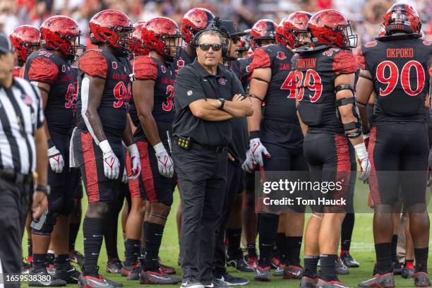 Head coach Brady Hoke of the San Diego State Aztecs walk son the field against the UCLA Bruins at Snapdragon Stadium on September 9, 2023 in San...