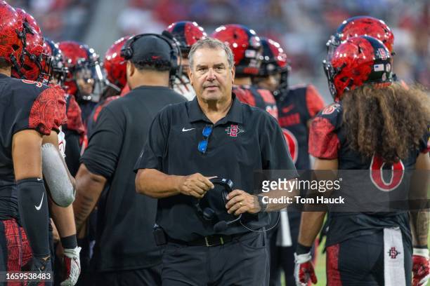 Head coach Brady Hoke of the San Diego State Aztecs walk son the field against the UCLA Bruins at Snapdragon Stadium on September 9, 2023 in San...