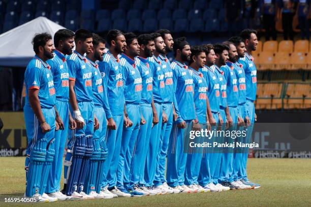 Indian players stand for the National anthem during the Asia Cup match between India and Sri Lanka at R. Premadasa Stadium on September 12, 2023 in...