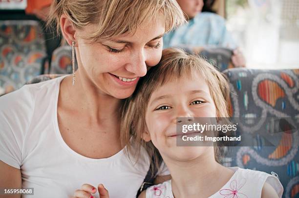 mother and daughter in bus - kids sitting together in bus stock pictures, royalty-free photos & images