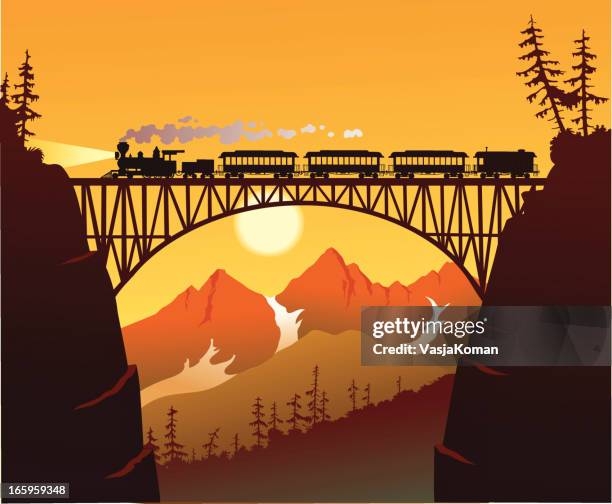 old fashioned steam train crossing the mountain bridge - locomotive stock illustrations