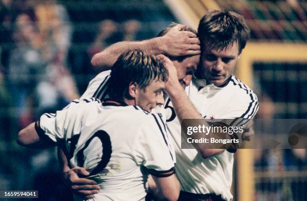 German footballer Thomas Hassler, German footballer Juergen Klinsmann, and Gerrman footballer Thomas Helmer celebrate during the 1998 FIFA World Cup...