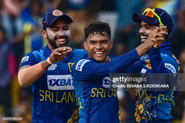 Sri Lanka's Dunith Wellalage celebrates with teammates after taking the wicket of India's Shubman Gill during the Asia Cup 2023 Super Four one-day...