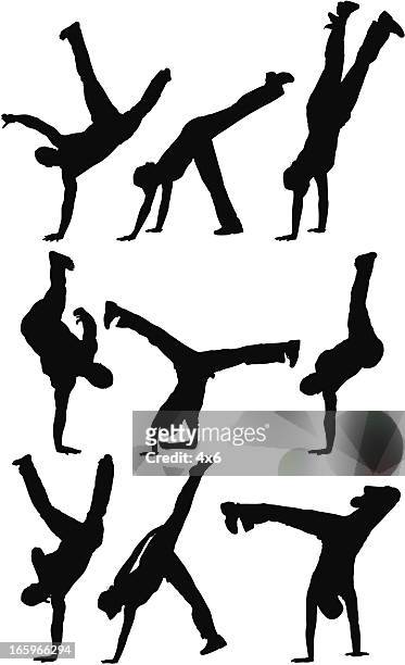 multiple silhouette of people practicing capoeira - upside down stock illustrations