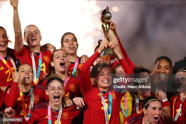Ivana Andres of Spain lifts the trophy and celebrates among team mates during the FIFA Women's World Cup Australia & New Zealand 2023 Final match...