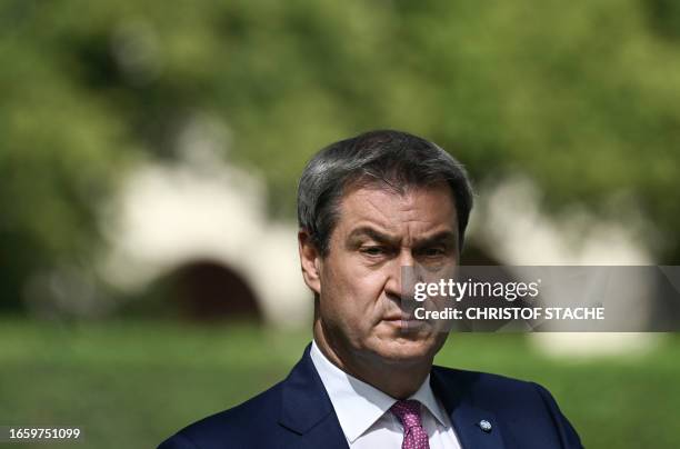 Bavaria's State Premier Markus Soeder attends a news conference after his meeting with Austria's Chancellor outside the State Chancellery in Munich,...