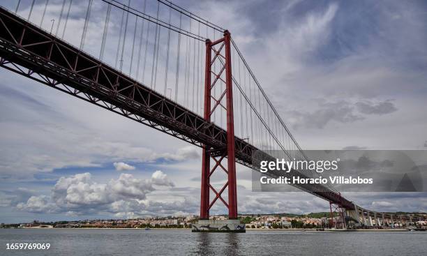 De Abril Bridge on Tagus River is silhouetted against the sky on September 03, 2023 in Lisbon, Portugal. Lisbon port is Portugal’s busiest port,...