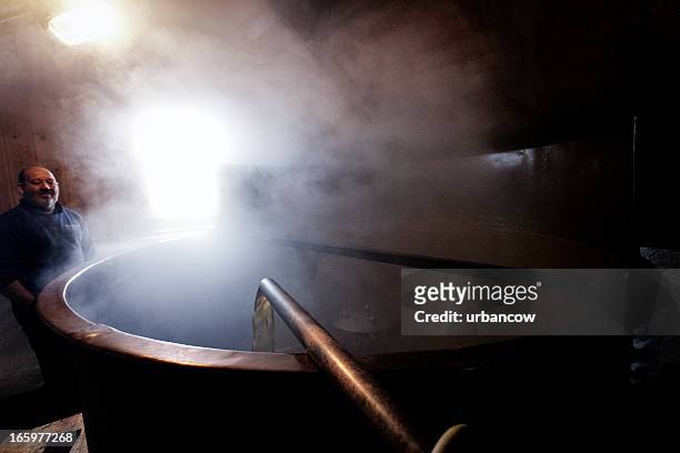 the copper, steam rising - vat stock pictures, royalty-free photos & images