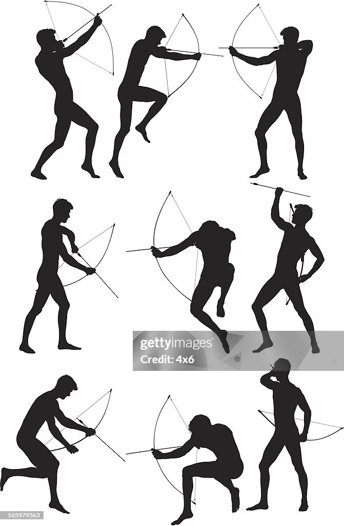 Silhouette of man aiming with a bow and arrow