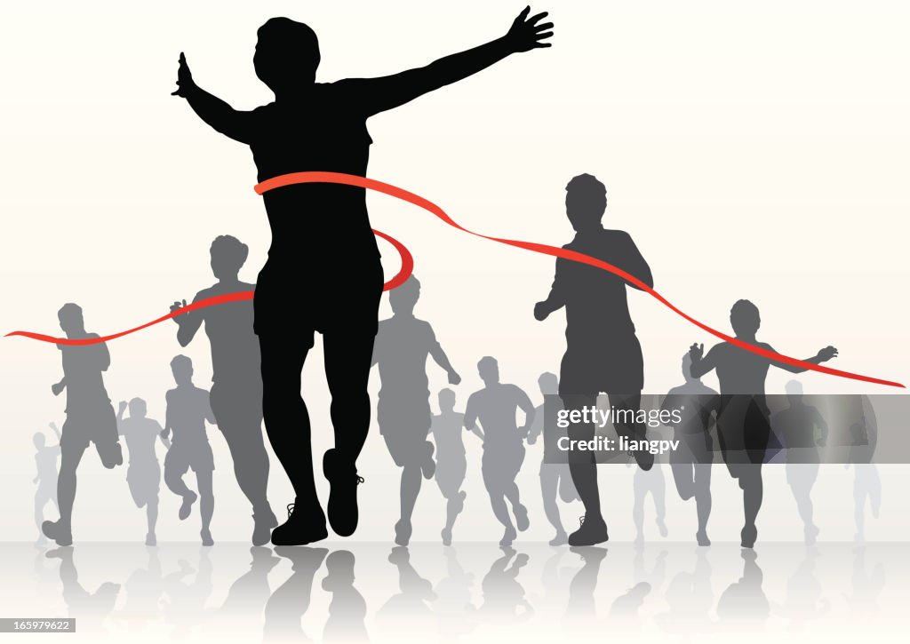 Silhouettes of marathon runners at the finish line