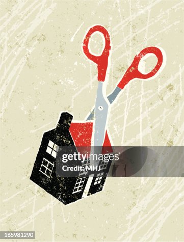 Scissors Cutting Through a Tiny House Scissors Cutting Through a Tiny House
