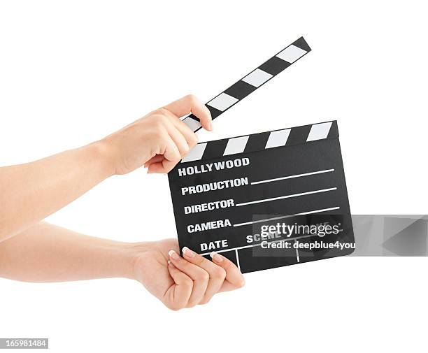 hollywood en pizarra de mujer manos aisladas - clapboard fotografías e imágenes de stock