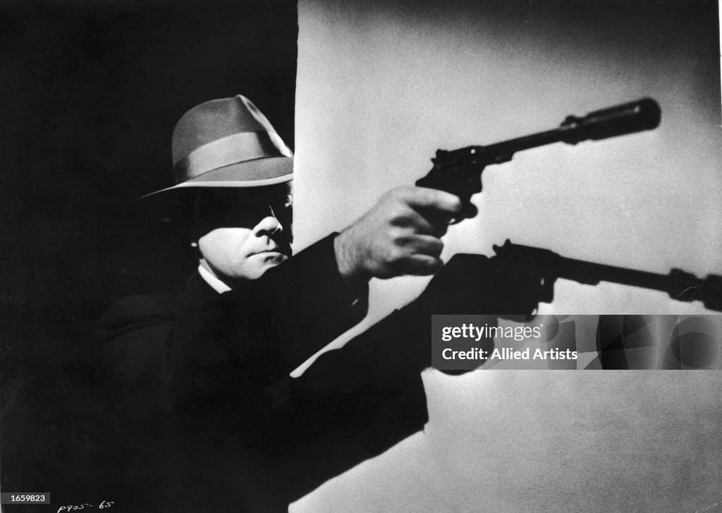 Gangster w/ silenced gun in still from "The Purple Gang," 1960.