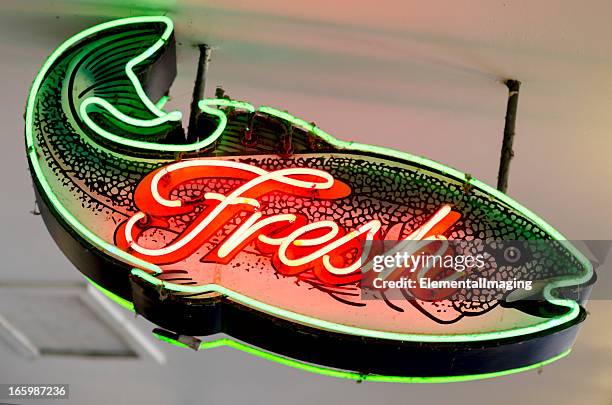classic americana neon fresh fish shaped sign - viswinkel stockfoto's en -beelden