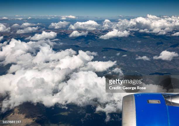 The Rocky Mountain front range is viewed from a United Airlines A319 climbing out of Denver International Airport on September 1 near Denver,...