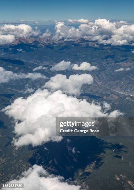 The Rocky Mountain front range is viewed from a United Airlines A319 climbing out of Denver International Airport on September 1 near Denver,...