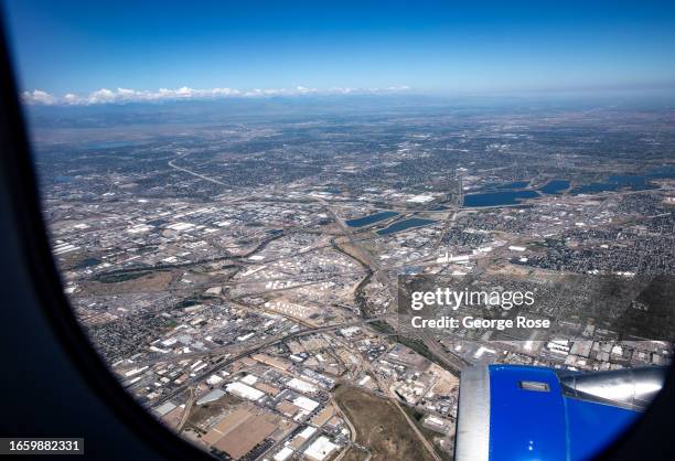 North Denver is viewed from a United Airlines A319 climbing out of Denver International Airport on September 1 over Denver, Colorado. The Colorado...