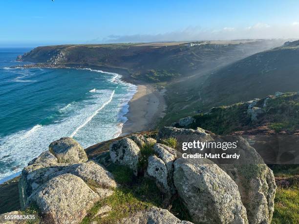 Waves roll in from the sea as morning mist lingers above Gwynver Beach on August 22, 2023 in Cornwall, England. The county of Cornwall, in the south...