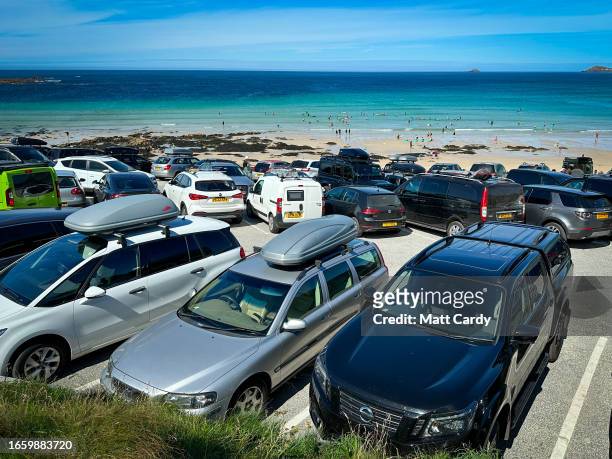 Visitors cars fill the beach car park at Sennen Cove on August 23, 2023 in Cornwall, England. The county of Cornwall, in the south west of England,...