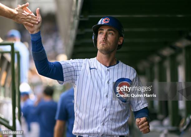 Cody Bellinger of the Chicago Cubs celebrates after scoring in the seventh inning against the San Francisco Giantsat Wrigley Field on September 04,...