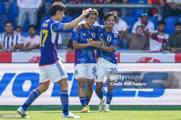 Kazimcan Karatas of Turkiye celebrates after scoring his teams second goal, Takefusa Kubo of Japan during the International Friendly match between...