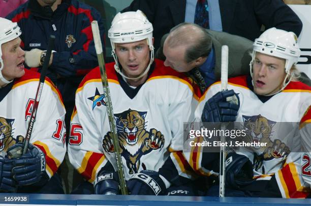 Head coach Mike Keenan of the Florida Panthers talks to Viktor Kozlov on the bench during the NHL game against the Pittsburgh Penguins on November 6,...