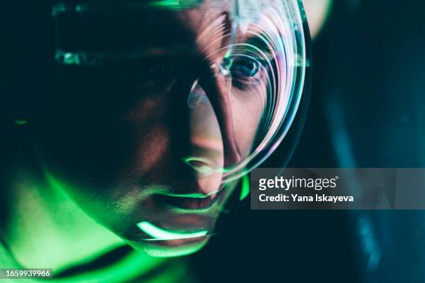 an astronaut in a futuristic helmet exploring the galaxy and outer space, embracing the unknown - rover stock pictures, royalty-free photos & images