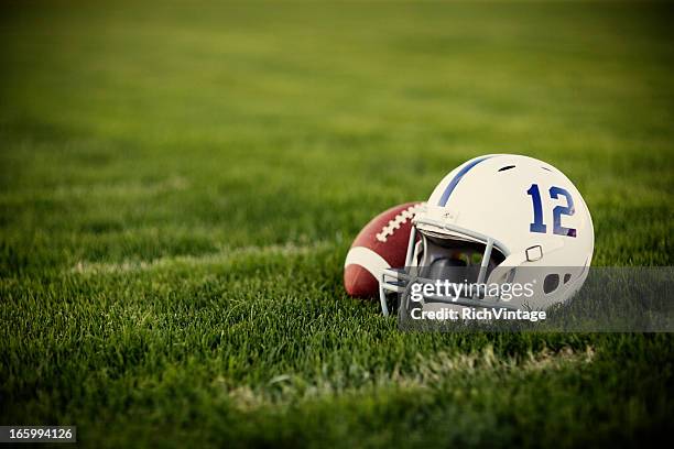 vintage football - football helmet stockfoto's en -beelden