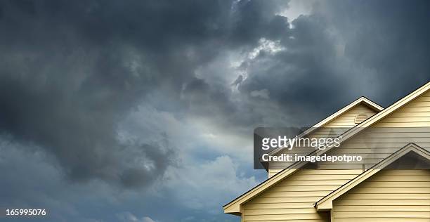 home in stormy day - natural disaster concept stock pictures, royalty-free photos & images