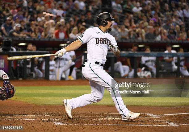 Jace Peterson of the Arizona Diamondbacks hits a two-RBI double during the fourth inning against the Colorado Rockies at Chase Field on September 04,...