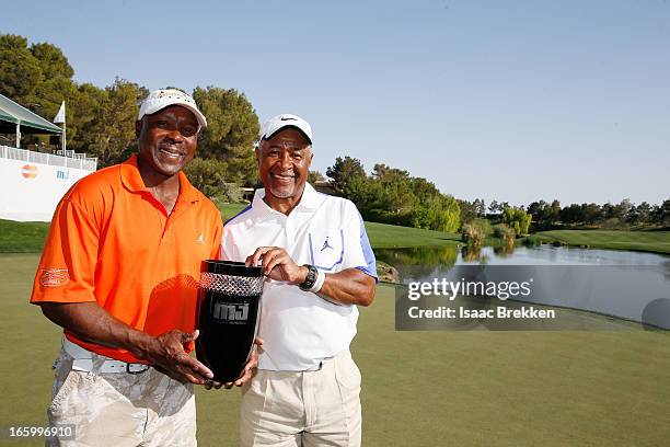 Former MLB players Vince Coleman and Ozzie Smith pose with a trophy after winning ARIA Resort & Casino's Michael Jordan Celebrtiy Invitational golf...