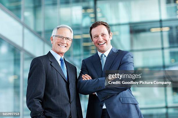 male executives with pleasing personality - posen stockfoto's en -beelden