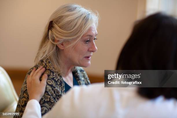 senior woman receiving help on care home - confusion bildbanksfoton och bilder