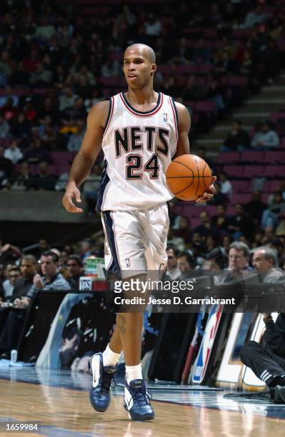 Richard Jefferson of the New Jersey Nets dribbles the ball during the NBA game against the San Antonio Spurs at Continental Airlines Arena on...