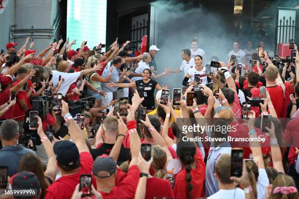 Lexi Rodriguez of Nebraska Cornhuskers leads the team onto the field before the match against the Omaha Mavericks at Memorial Stadium on August 30,...