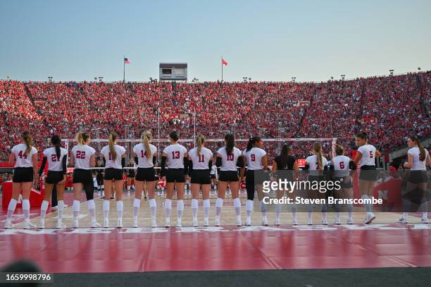 The Nebraska Cornhuskers stand on the court during introductions before the match against the Omaha Mavericks at Memorial Stadium on August 30, 2023...