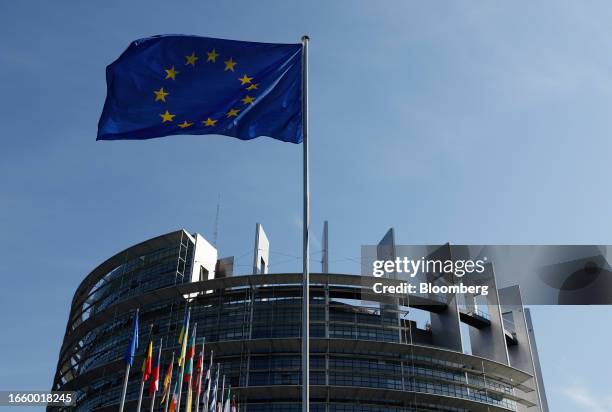 The European Union flag and flags of member countries at the European Parliament's Louise Weiss building in Strasbourg, France, on Tuesday, Sept. 12,...