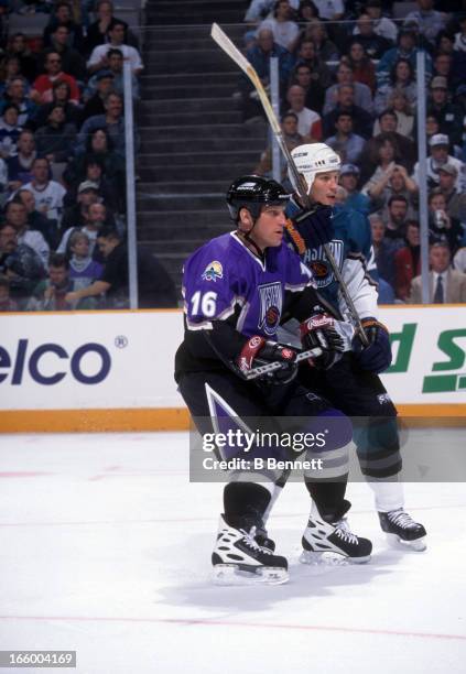 Brett Hull of the Western Conference and St. Louis Blues battles with Dino Ciccarelli of the Eastern Conference and Florida Panthers during the 1997...