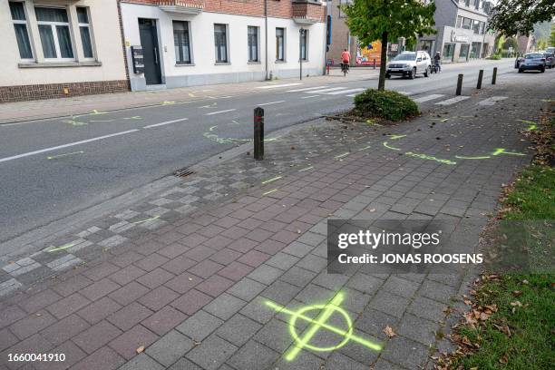 Illustration picture shows police markings on the ground at the scene of an accident in Kalmthout, where cyclist Nathan Van Hooydonck crashed into...