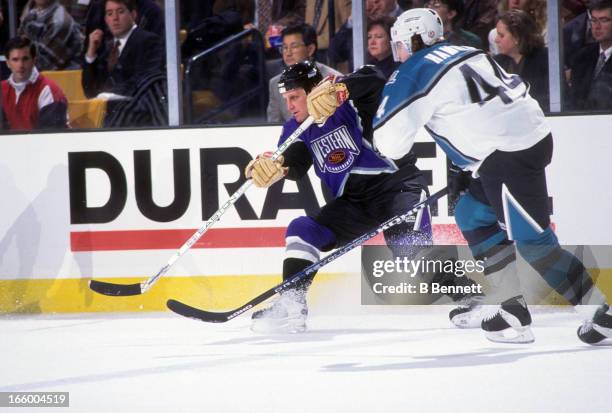 Brett Hull of the Western Conference and the St. Louis Blues is defended by Roman Hamrlik of the Eastern Conference and the Tampa Bay Lightning...