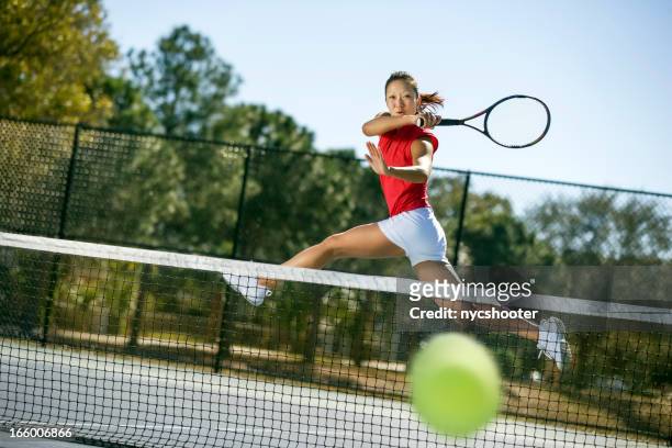 tennis player hitting forehand winner - taking a shot sport stock pictures, royalty-free photos & images