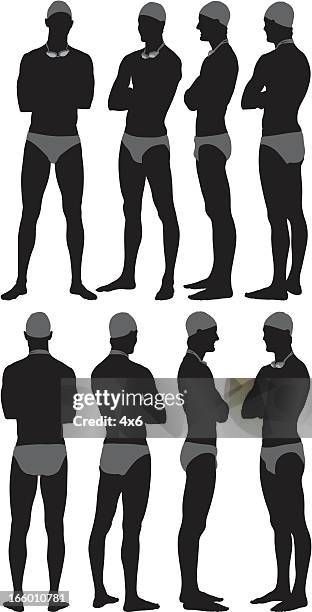 silhouette of a male swimmer posing - black men in speedos stock illustrations