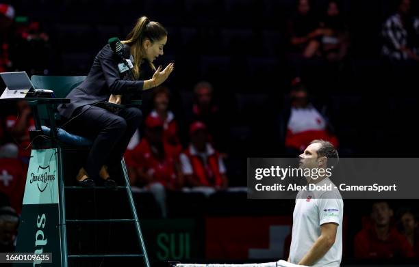 Umpire Marijana Veljovic speaks with the Switzerland coach Severin Luthi at AO Arena on September 12, 2023 in Manchester, England.