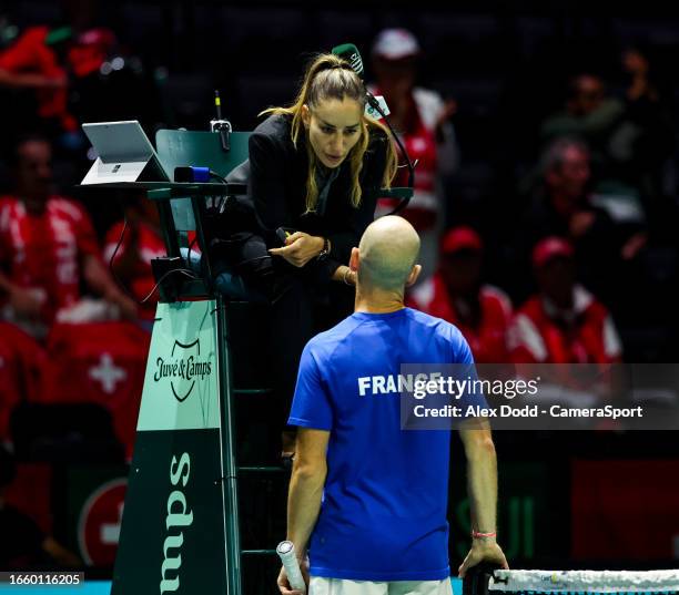 Adrian Mannarino of France speaks with umpire Marijana Veljovic at the AO Arena on September 12, 2023 in Manchester, England.