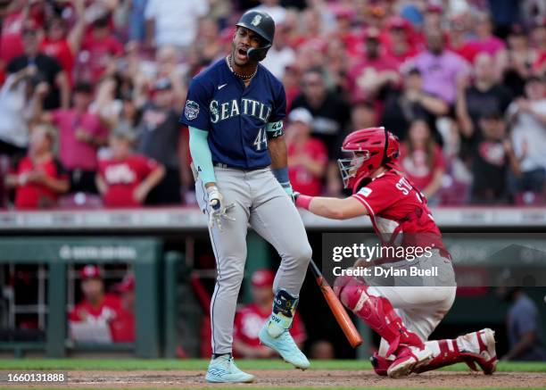 Julio Rodríguez of the Seattle Mariners reacts after striking out in the ninth inning to end the game against the Cincinnati Reds at Great American...