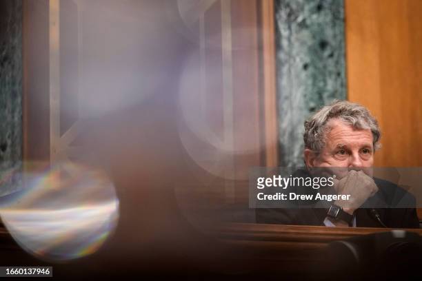 Committee chairman Sen. Sherrod Brown listens to testimony from U.S. Securities and Exchange Commission chairman Gary Gensler during a Senate Banking...